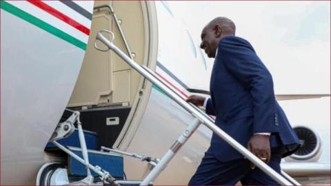 President William Ruto boarding a plane.